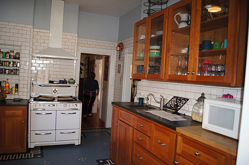 click to view larger image Victorian kitchen with walls lined with subway tile.